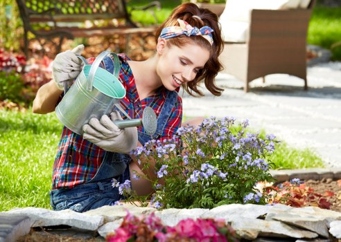 Landscaper reviewing service notes and site details